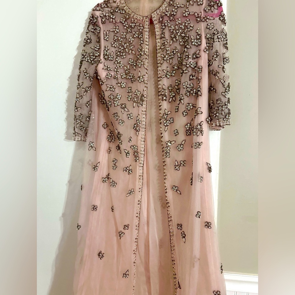 Hand embellished pink duster decorated with sparkling appliqués